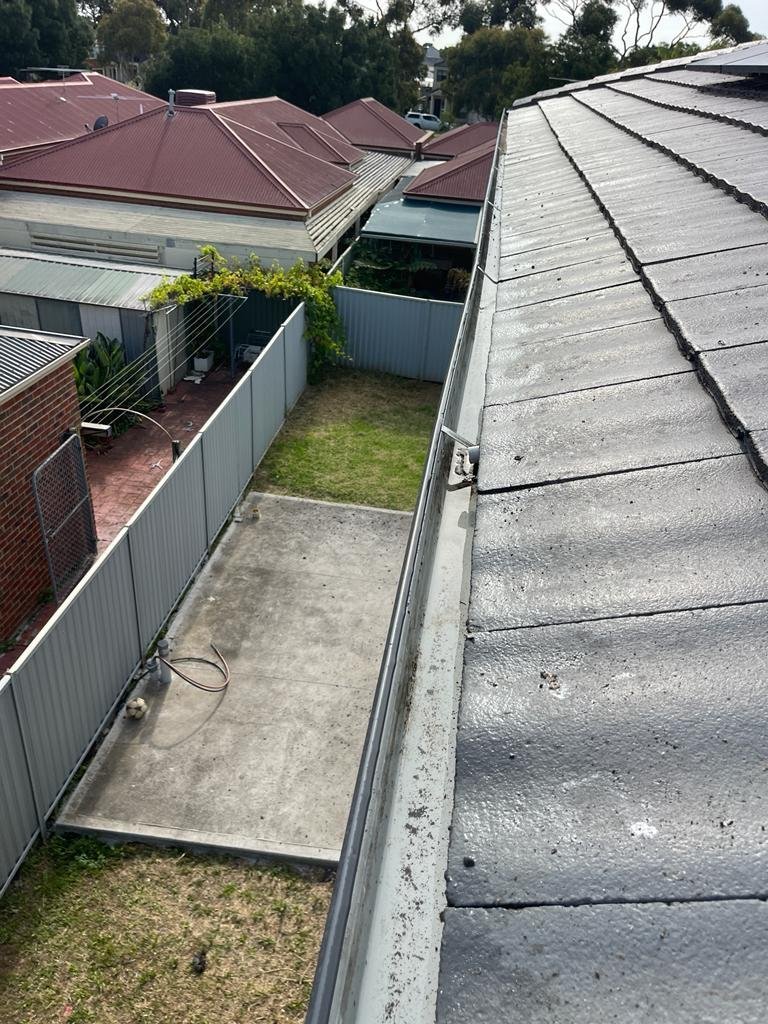Roof gutter debris — after